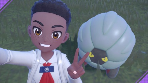 my character in Pokémon Violet, a young dark skinned black boy with a curly hi-top, posing with a shiny dragon Pokémon called Shelgon