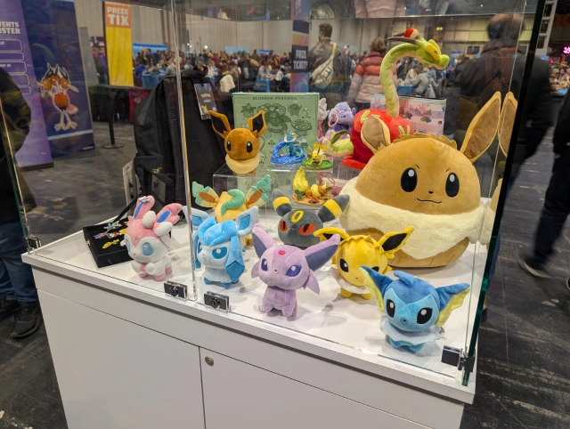 some Pokémon plushes in a display box